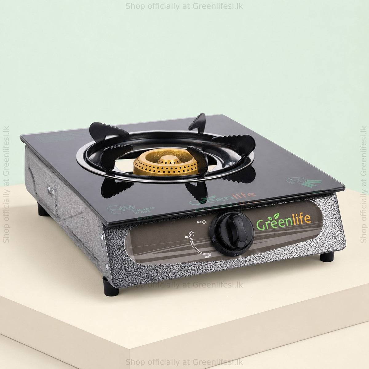 Green Life single burner glass top gas stove from the side, on a raised display block