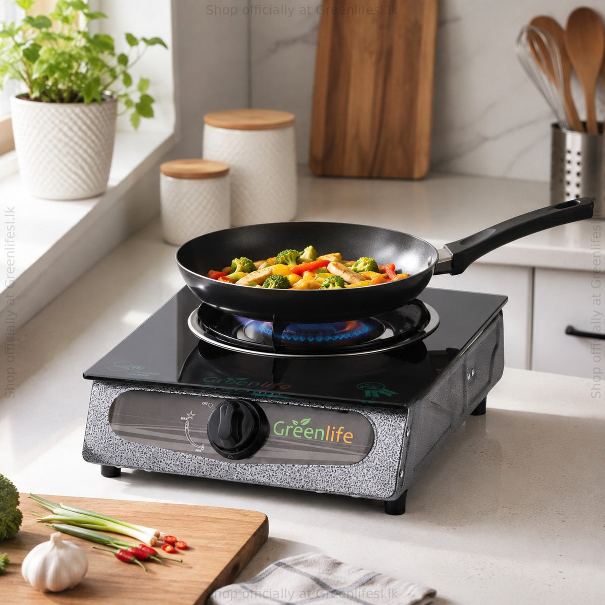 Green Life single burner glass top gas stove cooking stir-fried vegetables in a home kitchen
