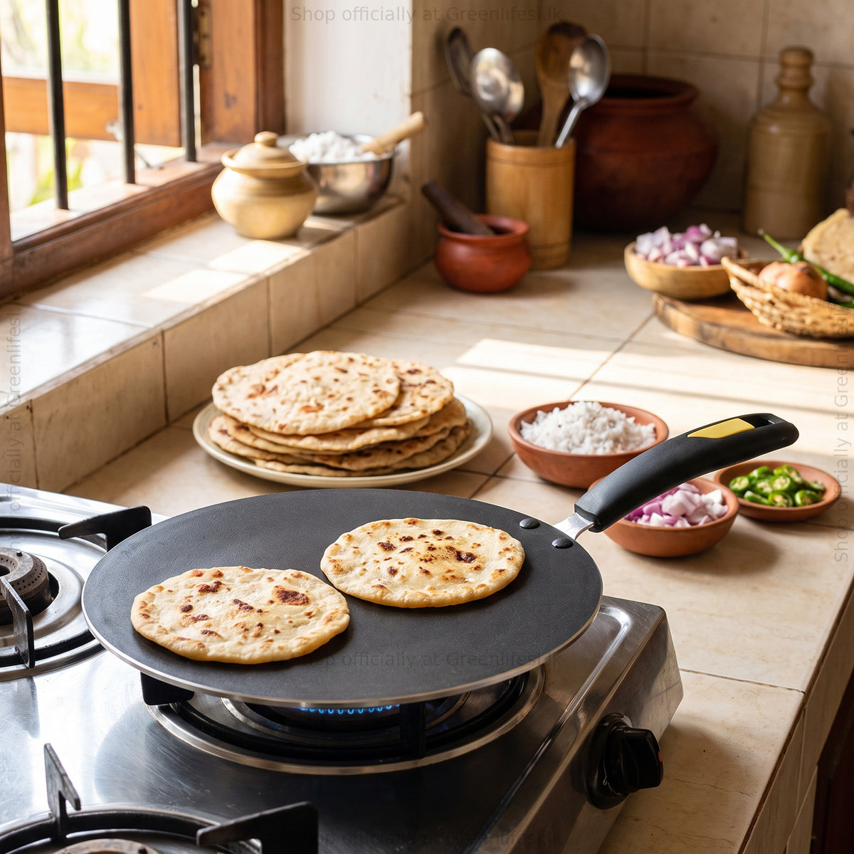 GreenChef Evok 280mm non-stick multipurpose tawa cooking parathas on a gas stove in a home kitchen