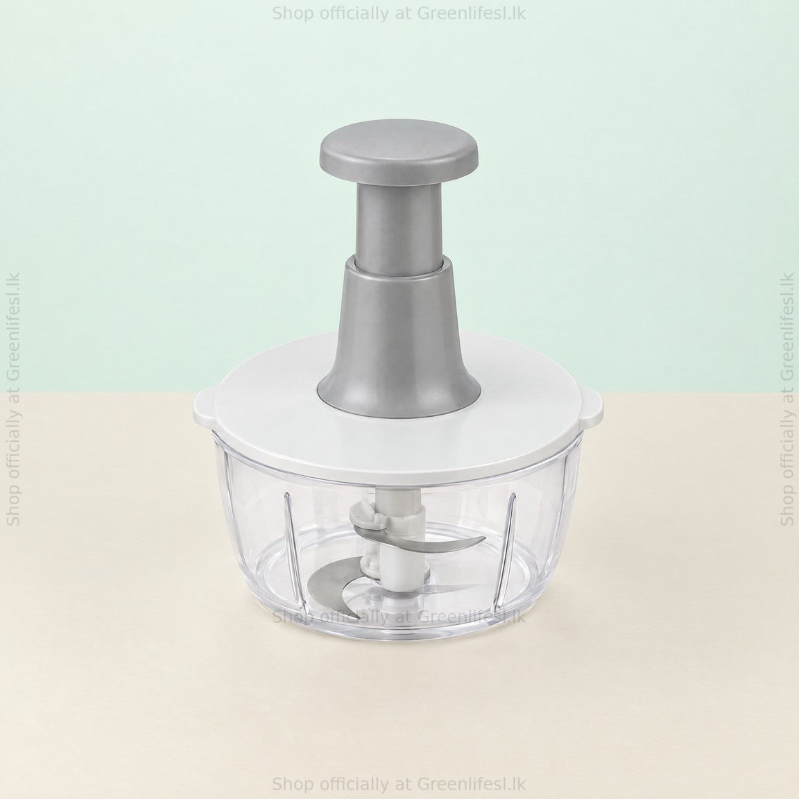 Greenlife 1.5L manual food chopper from a higher angle showing the blade inside the bowl