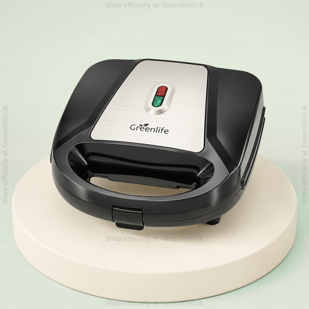 Greenlife 7-in-1 sandwich, waffle and donut maker, closed, with brushed steel lid and indicator lights