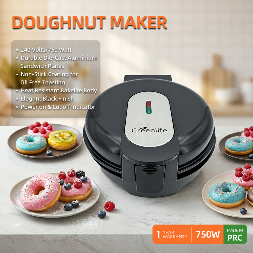 Greenlife electric doughnut maker on a kitchen counter with fresh decorated donuts.
