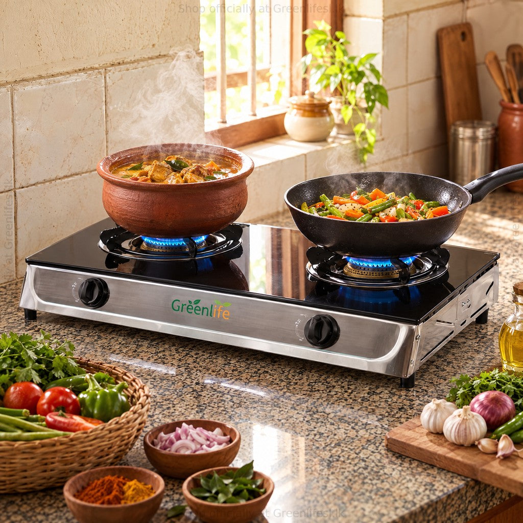 Green Life 2-burner tempered glass top gas cooker cooking curry and vegetables in a home kitchen