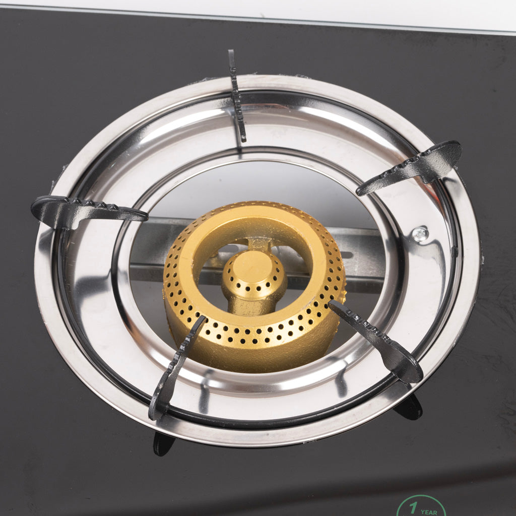 Green Life gas stove burner detail showing auto ignition feature and premium build quality
