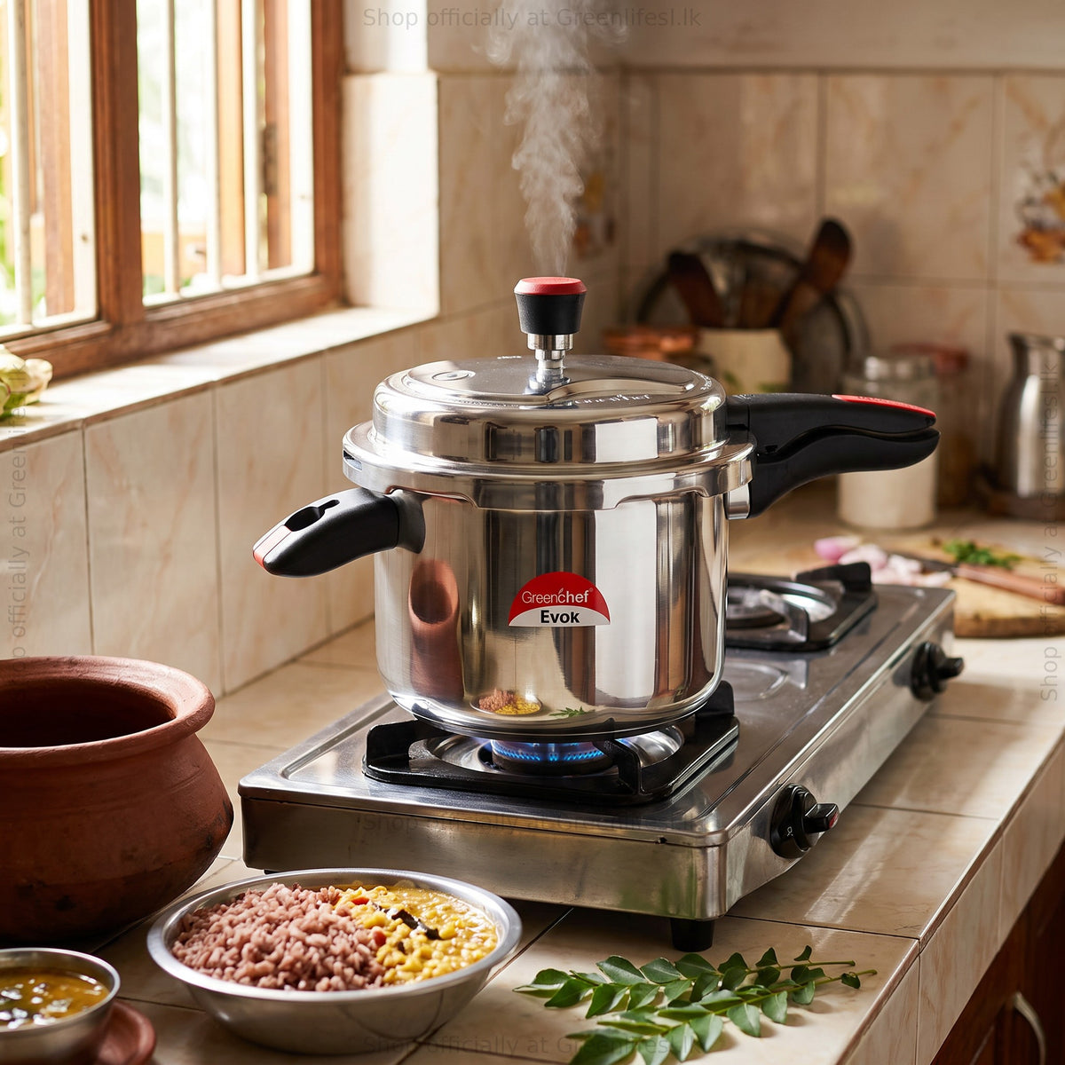 GreenChef Evok 7.5L aluminium pressure cooker steaming on a gas stove in a home kitchen