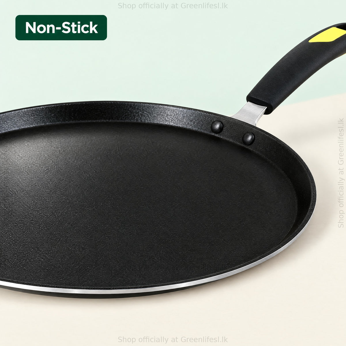 GreenChef Evok non-stick flat tawa close-up of the non-stick cooking surface and riveted handle