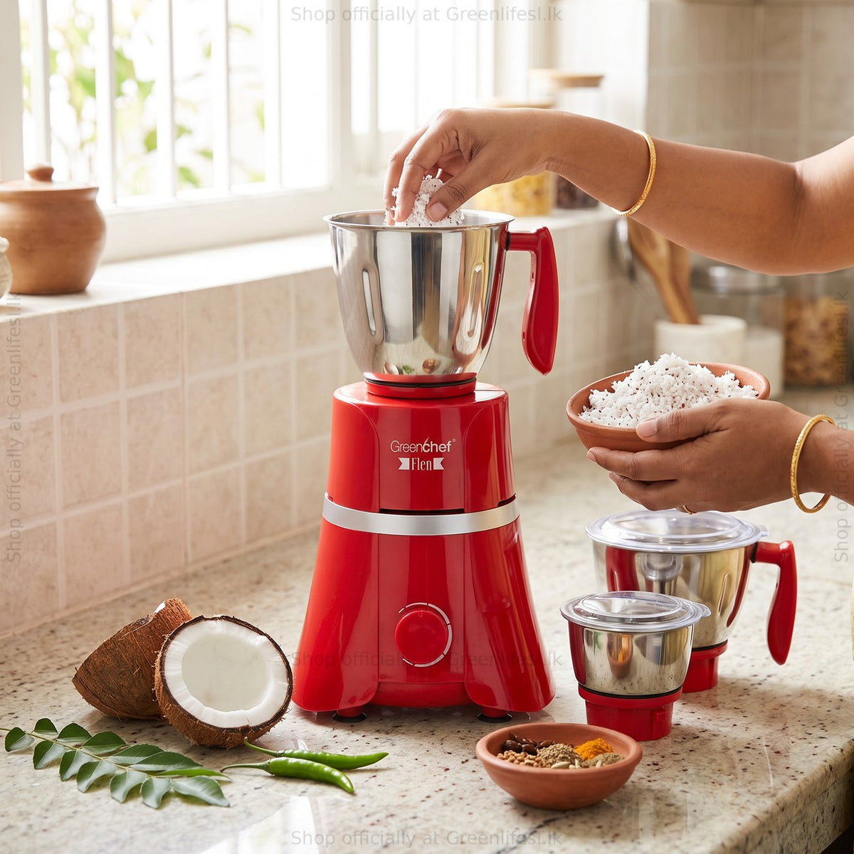 GreenChef Flen 1HP mixer grinder being filled with grated coconut on a home kitchen counter