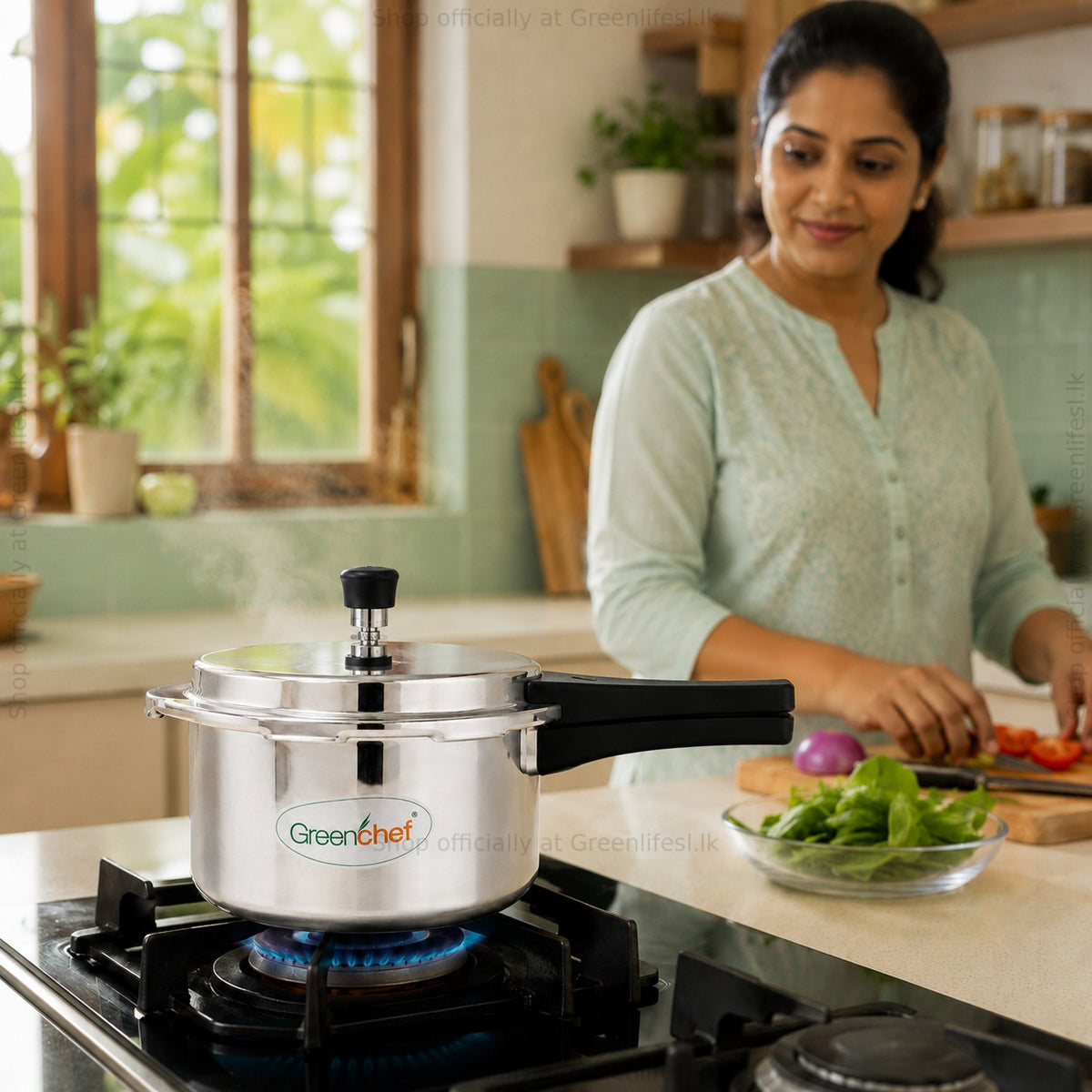 GreenChef Namo 3L pressure cooker steaming on a gas hob while vegetables are prepared