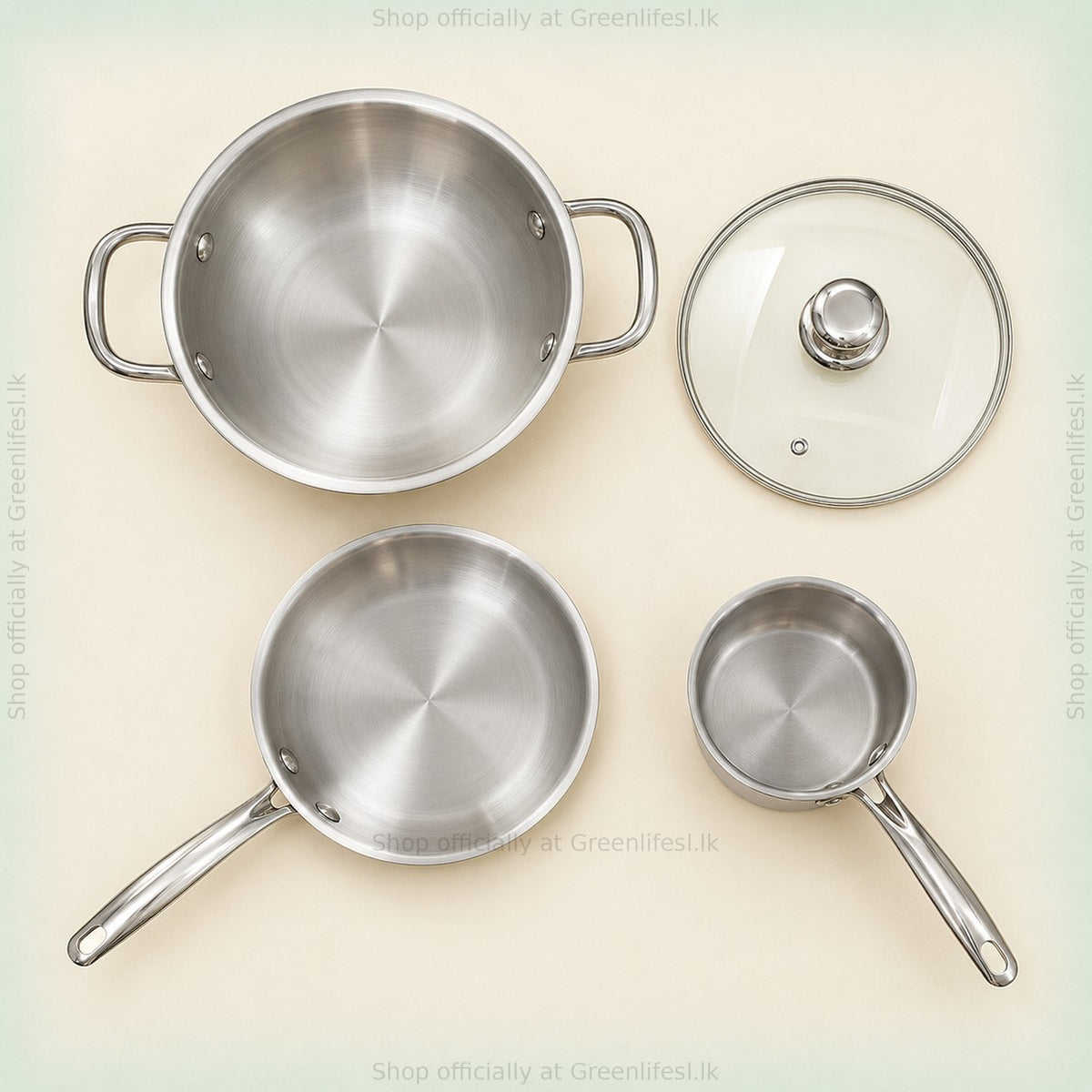 GreenChef Steel Crest tri-ply cookware from above: kadai, glass lid, fry pan and saucepan