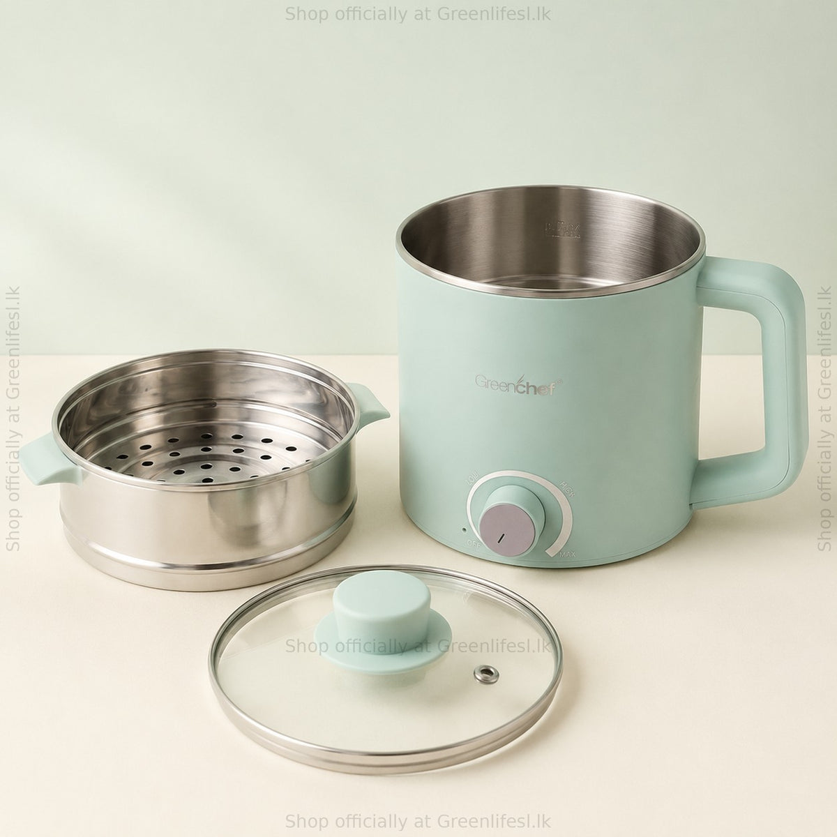 GreenChef Zylo Pro 1.5L multi kettle with steamer basket and glass lid laid beside it