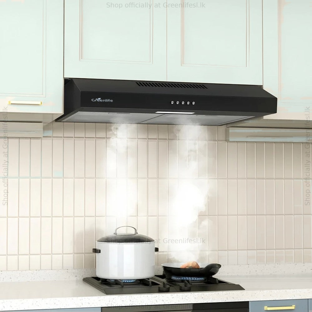 Greenlife 60cm cooker hood under a kitchen cabinet drawing steam from cooking on a gas hob
